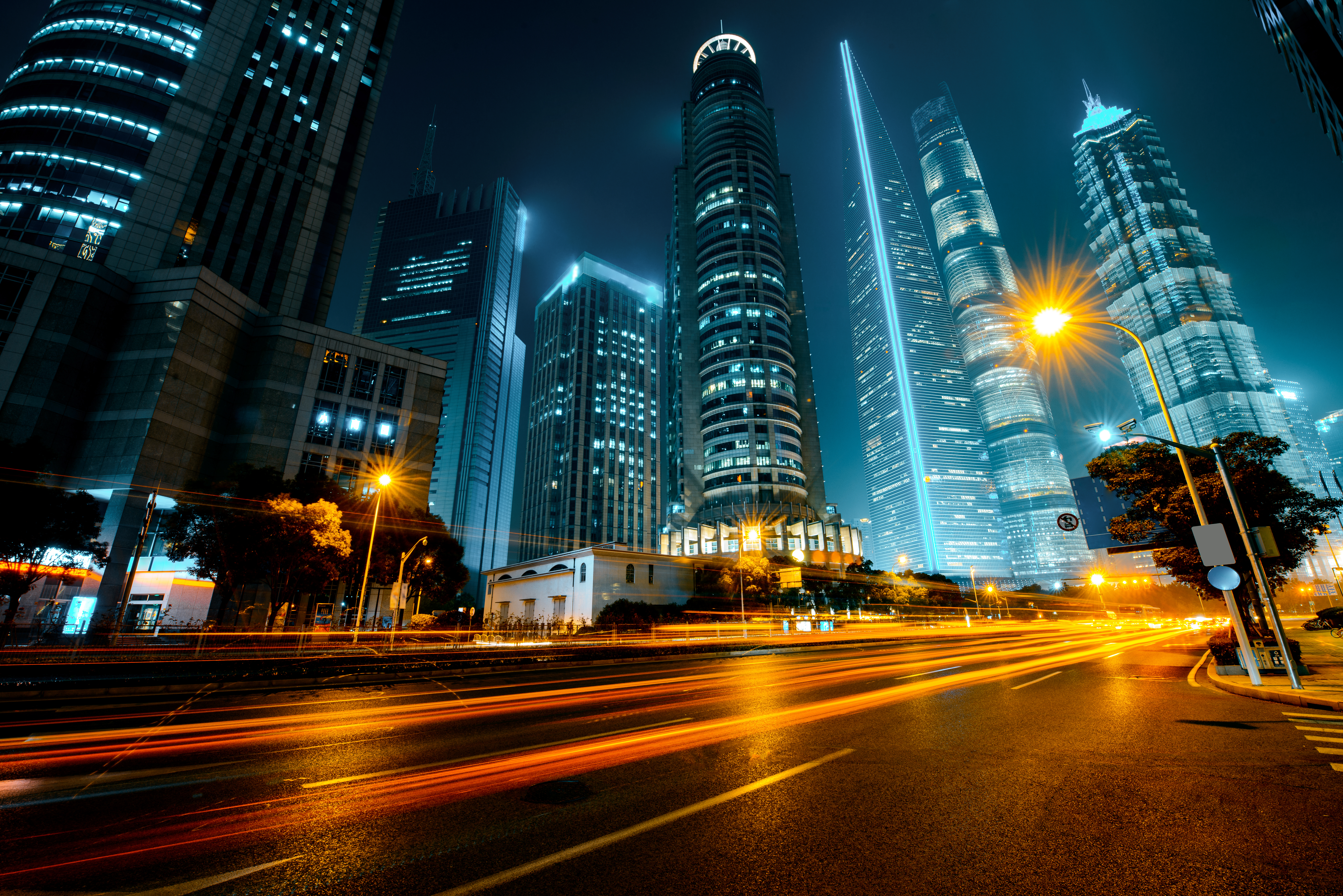 Vehicles passing through a busy urban intersection at night, Plates treats every read as the start of an operational record